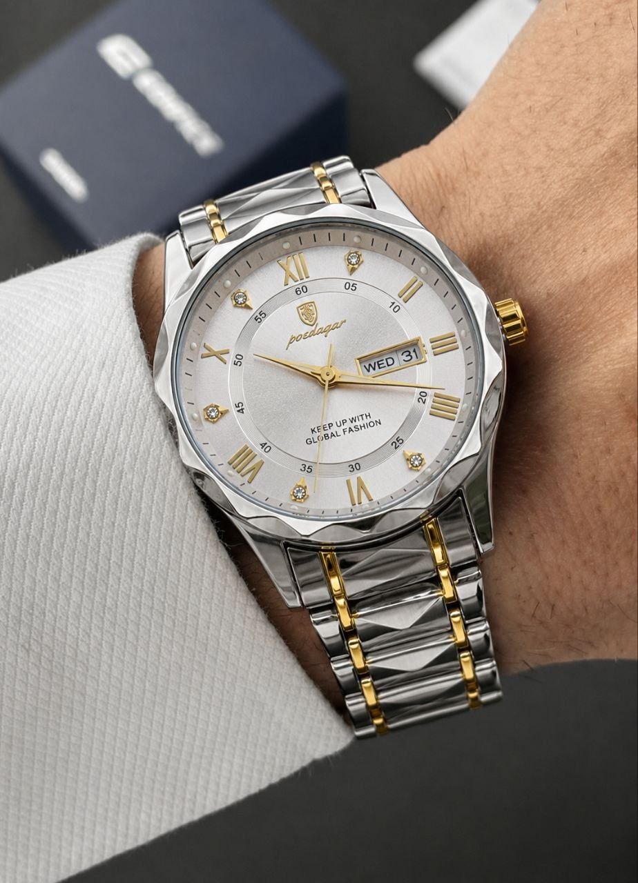 ساعت مچی مردانه ☑️poedagar   《highe quality》                       ⌚️پودگار مدلی نو  ✨ ظرافتی که در همان نگاه اول دل می‌برد ✨ ⌚️ ترکیب چشم‌نواز طلایی و نقره‌ای 💎 طراحی خاص و متفاوت 🎁 مناسب هدیه و استفاده روزمره  دارای روز شمار و ایام هفته  صفحه شب نما  برند شرکتی  طرح الماس بند استیل مقاوم در برابراّب  رنگ ثابت  قفل پروانه ای