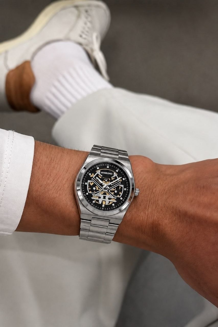 ساعت مچی مردانه ☑️BIN BOND   《highe quality》       🫆Original watch               ⌚️بین باند مدلی نو     ساعت اسکلتون BINBOND با صفحه مشکی خاص و بدنه استیل، انتخابی برای کسانی که متفاوت بودن را دوست دارند.  مقاوم دربرابر آب برندشرکتی اوریجینال   شب نما موتور نمایان   بند استیل فولاد شیشه سافایر  قفل دو پروانه  موتور  PE30  آرام گرد